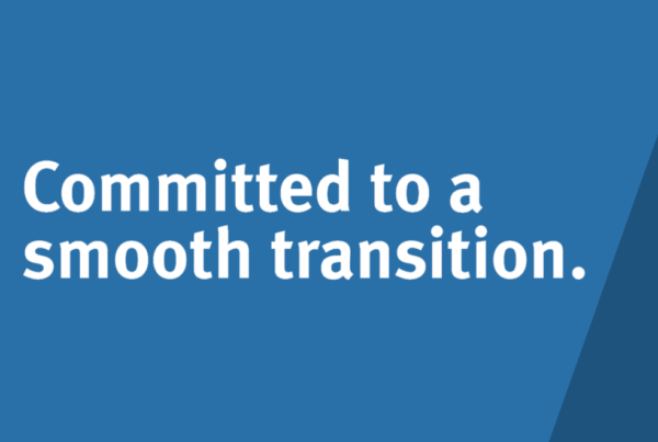 Blue page with text "Committed to a smooth transition."